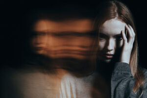 A woman experiences a psychotic episode caused by drugs. This is a conceptual image that features a blurring effect.