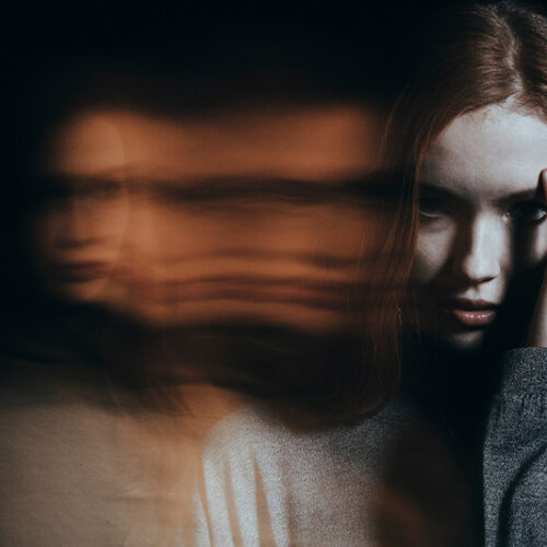 A woman experiences a psychotic episode caused by drugs. This is a conceptual image that features a blurring effect.