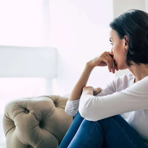 A woman struggles with major depression, one of the types of depression.