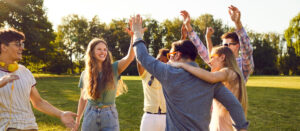 A group of California sober friends spend time together in a park.