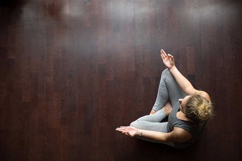A woman practices meditation.